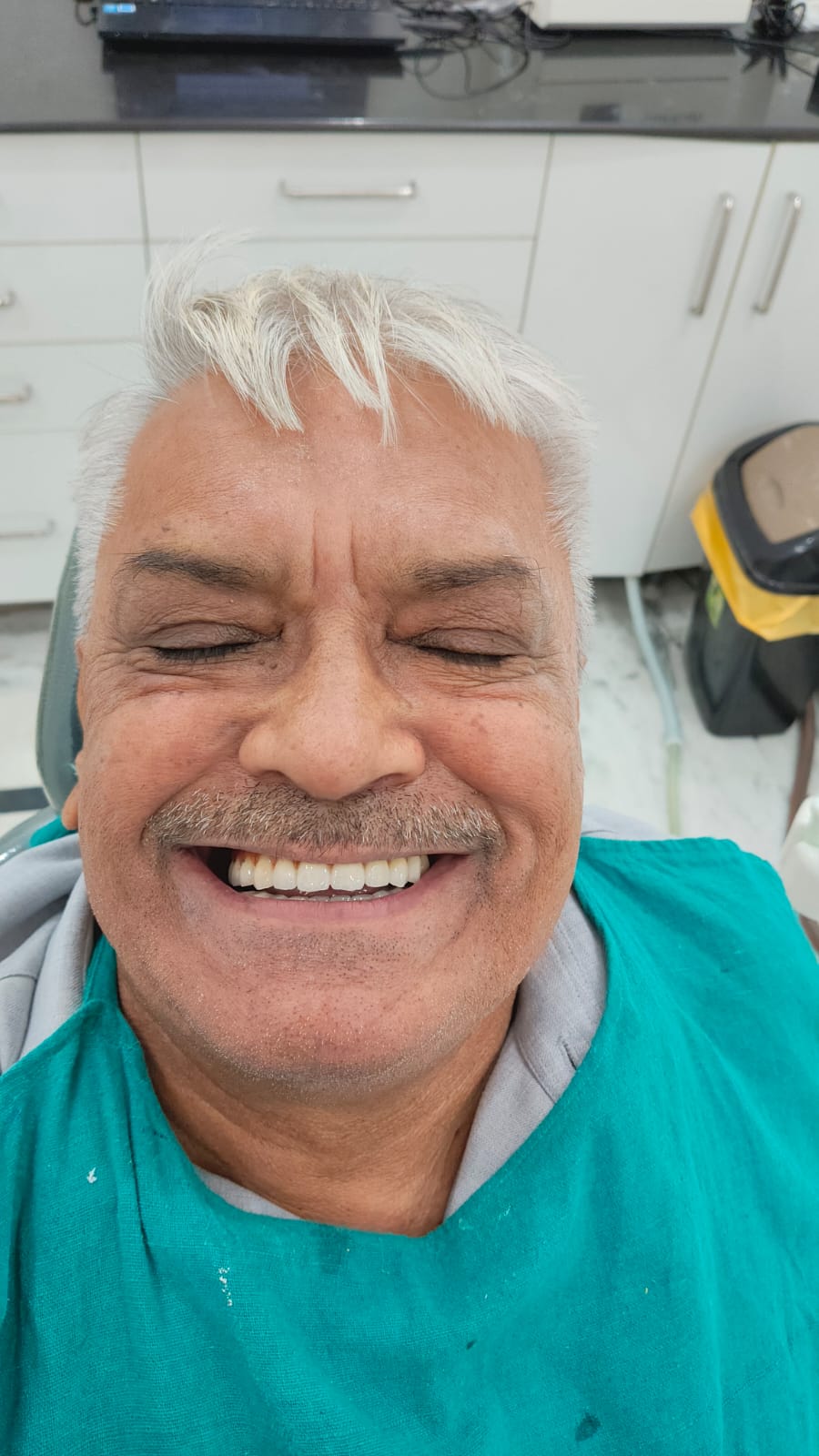 Happy patient after full mouth restoration